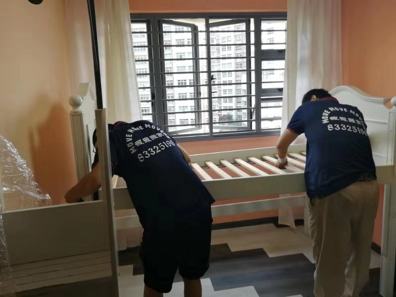 HDB flat moving in Singapore with careful furniture wrapping and lift protection