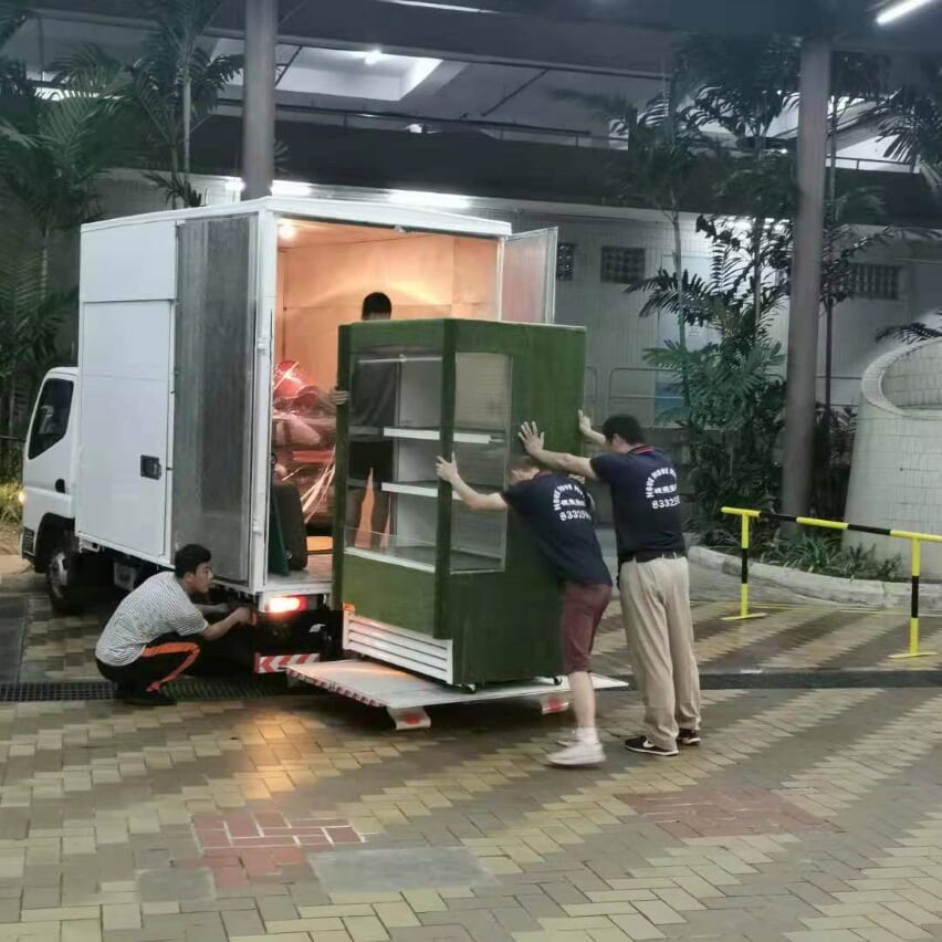 Large household appliance being loaded into a Move Move Movers truck in Singapore