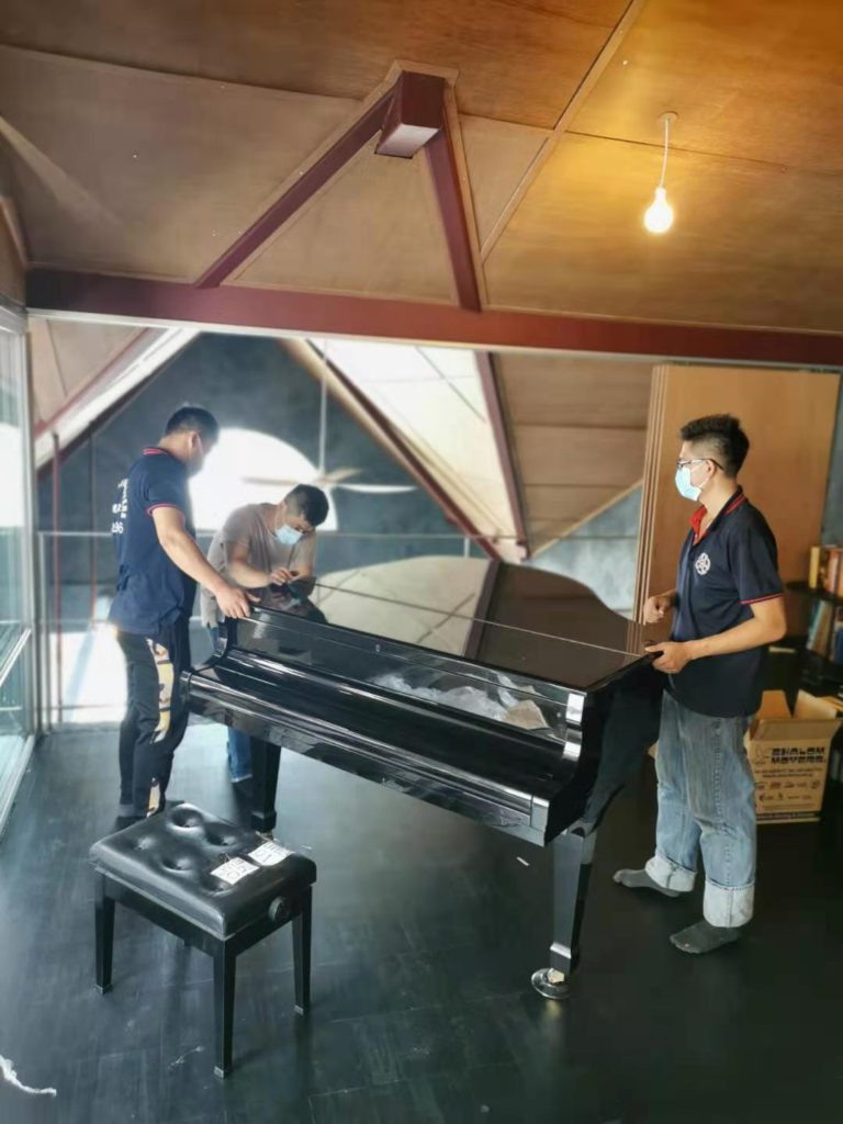 Grand piano dismantling and protective wrapping service