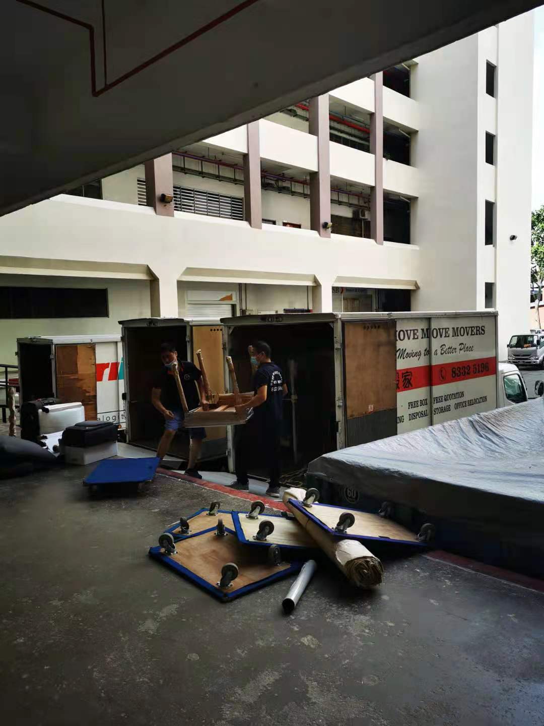 Move Move Movers crew loading office furniture into a branded truck during an office relocation at Science Park