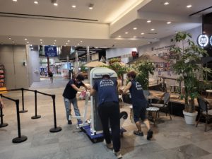 Move Move Movers crew coordinating a commercial relocation inside a Singapore business venue