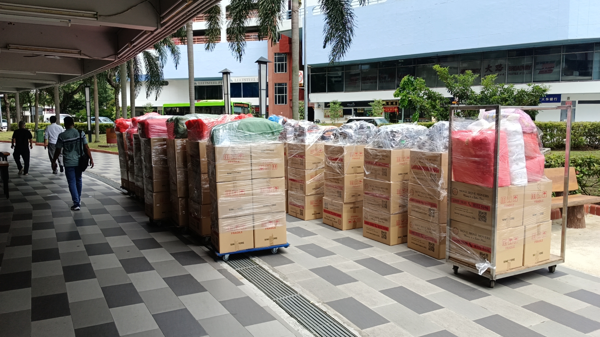 Office cartons and wrapped items staged for a Singapore office relocation by Move Move Movers