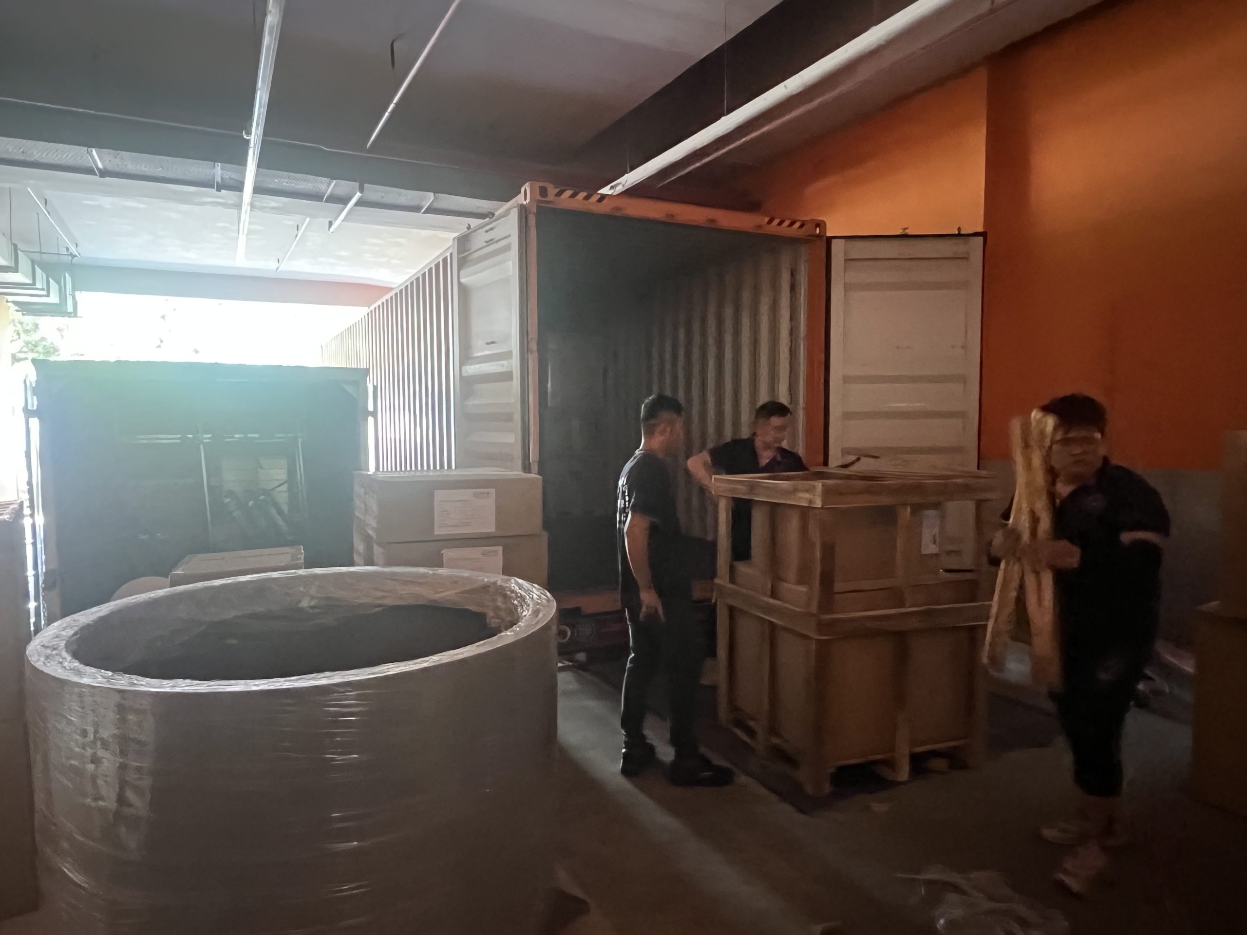 Wooden crate handling from container - move move movers – move move movers – move move movers Move Move Movers crew unloading a wooden crate and wrapped commercial item from a shipping container