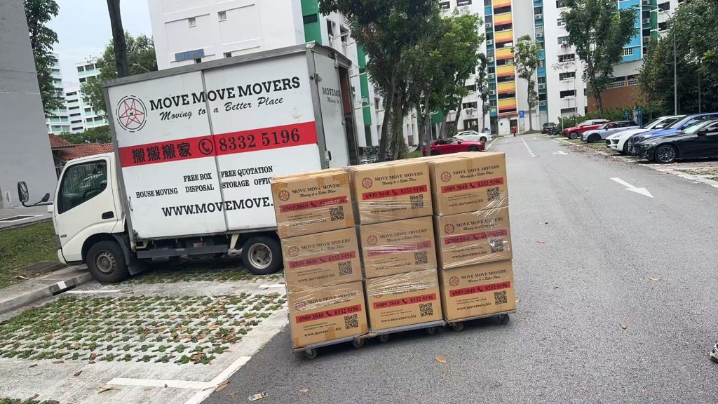 Move Move Movers lorry and packed cartons during an HDB house move in Singapore