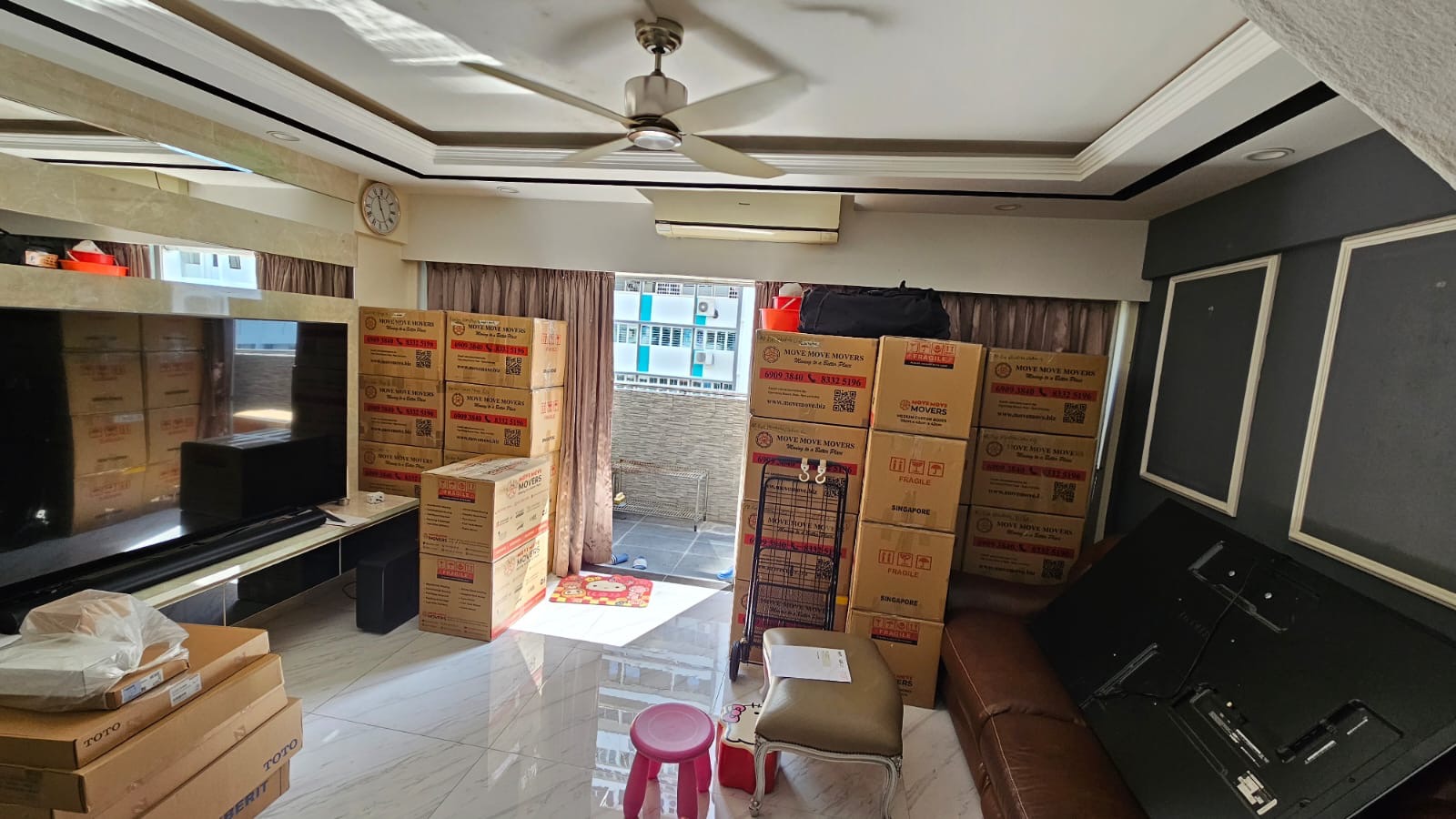 Packed household rooms prepared for full-house clearance in Singapore