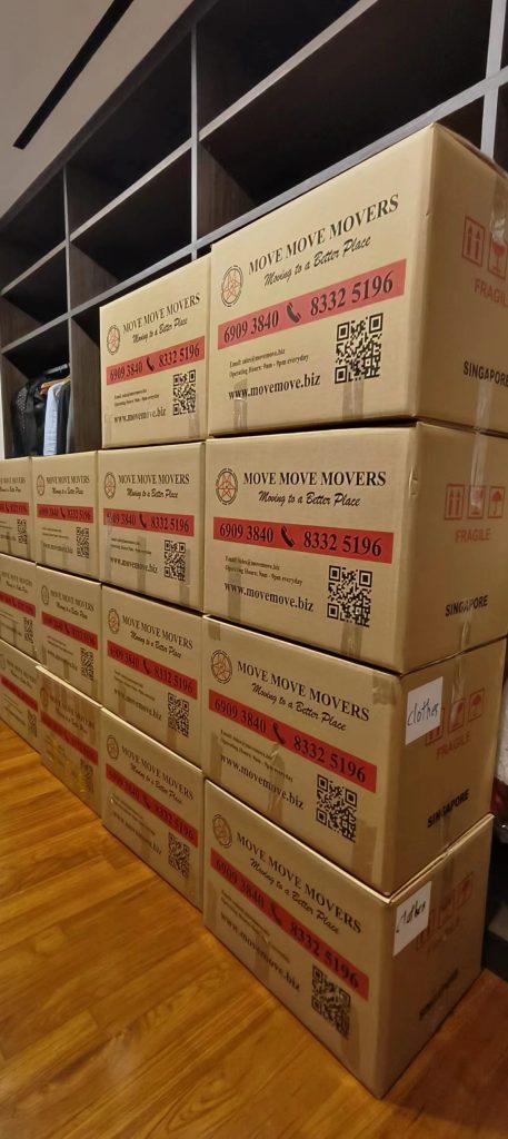 Stacked Move Move Movers branded moving cartons prepared for packing service