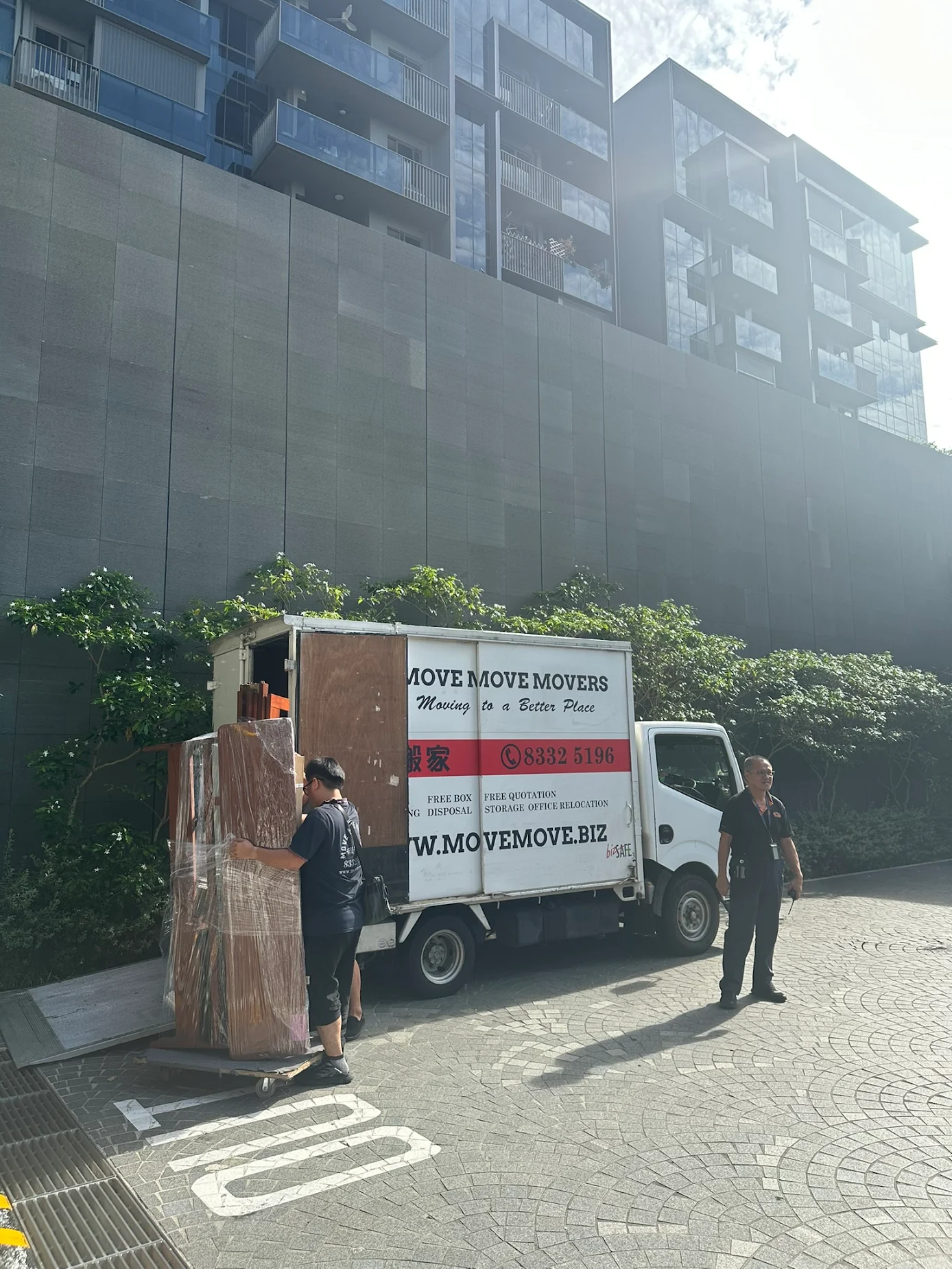 Condo-side staging before sofa removal in Singapore