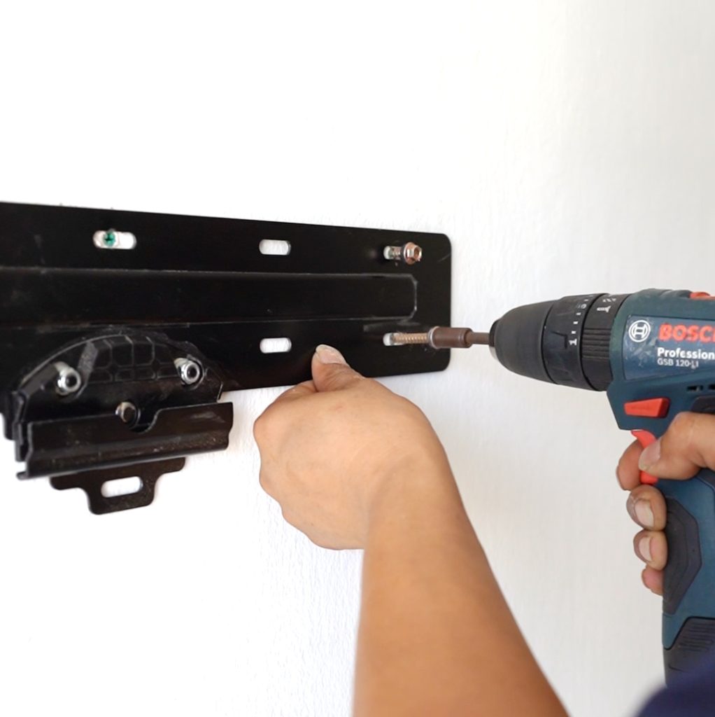 TV wall mount bracket installation using power drill in Singapore