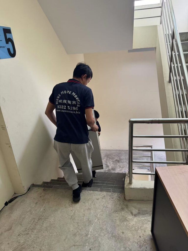 Cabinet and furniture pieces being loaded for disposal in Singapore